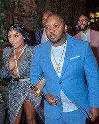 a woman in a blue suit and a man in a blue suit